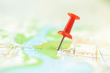 Selective focus of push pin on the map, red marker on navigation map concept