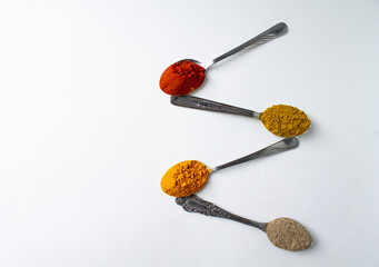 a few spoons with colorful seasonings. white background (совпадений: 99)
