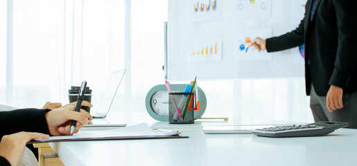 Banner background and selective focus on table with hand writing minute meeting. Blur man...