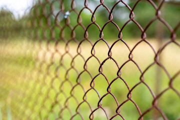 Steel rusty metal mesh, selective focus with beautiful bokeh.