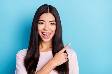 Photo of young attractive girl happy positive smile point fingers empty space ads advise choice...