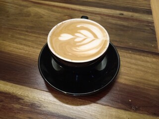 cup of coffee on wooden table