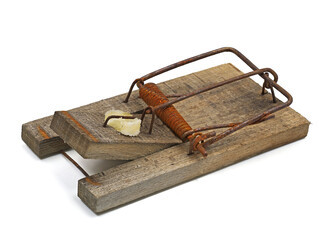 old rusty mousetrap with cheese bait isolated on white background