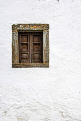 Old window in white wall