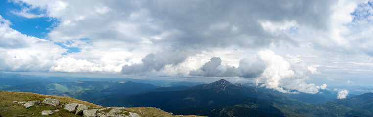 Panorama of the Carpathian mountains at the beginning of summer in Ukraine, rest and travel in the mountains
