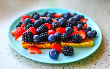 Delicious Waffles with fresh berries and chocolate
