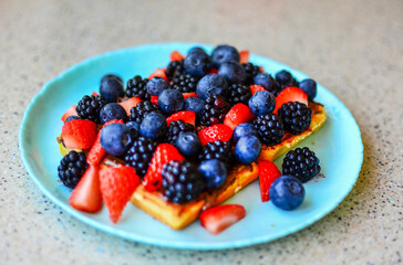 Delicious Waffles with fresh berries and chocolate
