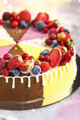 Ice cream cake with frozen berries on a light background 