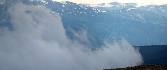 Fog on the background of mountains in the carpathians