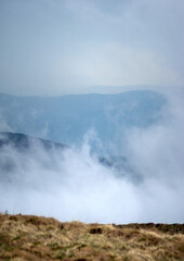 Fototapeta na wymiar Fog on the background of mountains in the carpathians