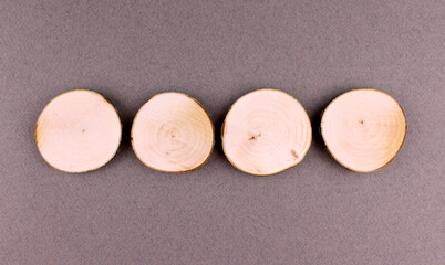 Round wooden log cabins on a gray background. Empty wooden frames
