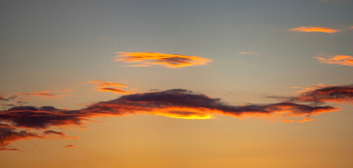 Beautiful colorful orange clouds at sunset, beautiful summer landscape in the evening in the Carpathians