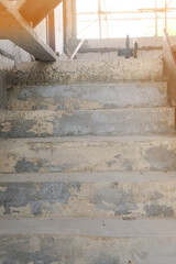step up stairs concrete in new house structure use lightweight cement brick and white lintel plaster to joint for reinforce in site.
