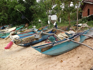 A catamaran fishing boat on a beach in Sri Lanka