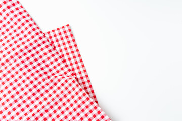 Top view tablecloth texture. Abstract fabric checkered red and white, isolated on a white background with copy space.