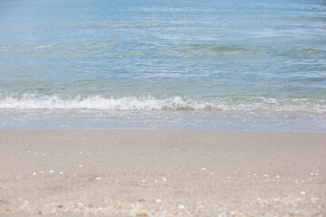 Beach, beautiful crystal blue water with wave on sandy shore