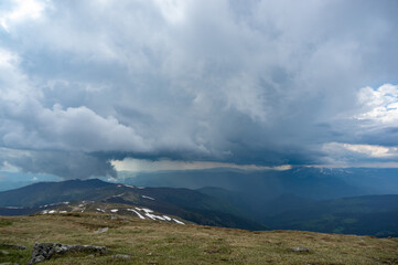 Fototapeta na wymiar Rain cloud and rain wall in the carpathian mountains