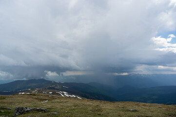 Fototapeta na wymiar Rain cloud and rain wall in the carpathian mountains