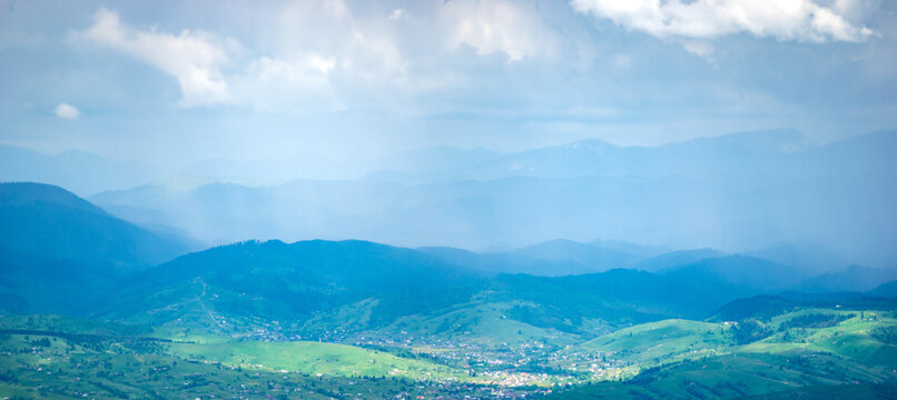 Panorama of the Carpathian mountains at the beginning of summer in Ukraine, rest and travel in the mountains