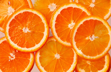 Juicy orange slices, orange background, orange texture