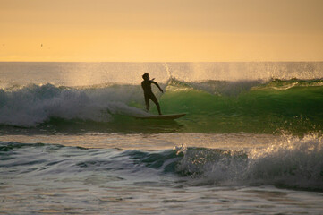 surfer cilhouette at sunset © Tonino