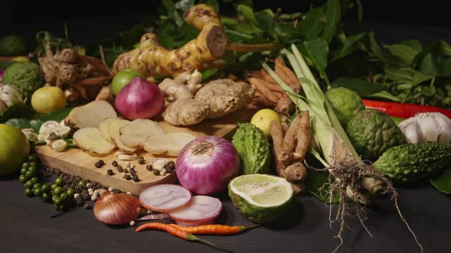 Spicy foods can stop the growth of the virus.Condiments with spicy taste on black background..high quality 4K video with herb background.