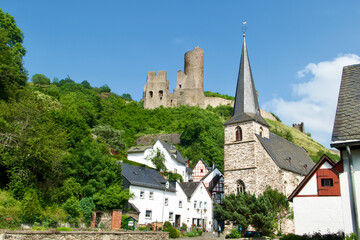 Monreal, Eifel, Germany an old small town with half-timbered house and a castle ruin on a small hill near the town