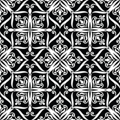 Wallpaper in the style of Baroque. A seamless background. Black and white Floral ornament.