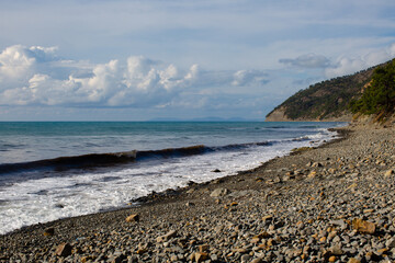 Empty rocky sunny beach of the sea