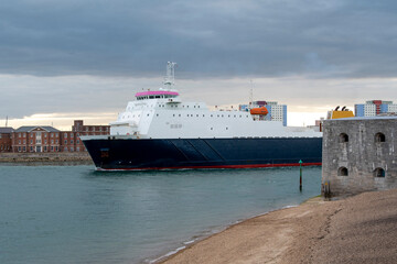 Portsmouth, England, UK. 2021. A roro cargo ship underway exiting Portsmouth Harbour, UK.