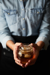 barista hands offering a cup of iced tea drink