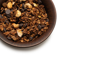 Chocolate granola cereal with nuts in a bowl background.