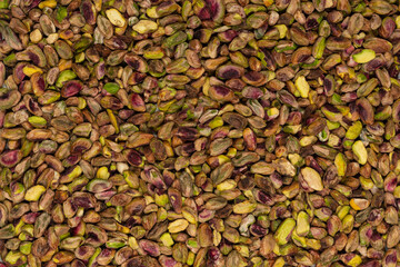 Peeled tasty pistachios as a background.