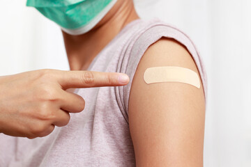 Woman get vaccinated for social immunization. - obrazy, fototapety, plakaty