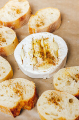 DIY baked cheese camembert instruction step by step. step 4 add olive oil. cheese with white mold.moldy cheese.