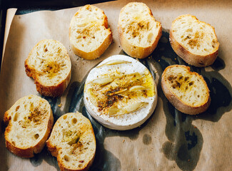 homemade DIY baked camembert with garlic.cheese with white mold.baked cheese.