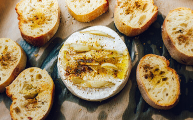 homemade DIY baked camembert with garlic.cheese with white mold.baked cheese.