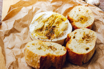 homemade DIY baked camembert with garlic.cheese with white mold.baked cheese.