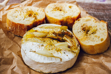homemade DIY baked camembert with garlic.cheese with white mold.baked cheese.