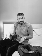 Unhappy shocked man with chronic breathing issues surprised by using  CPAP machine sitting on the...