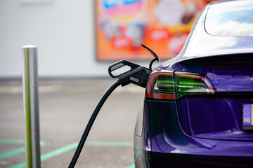electric car being charged at public charging point