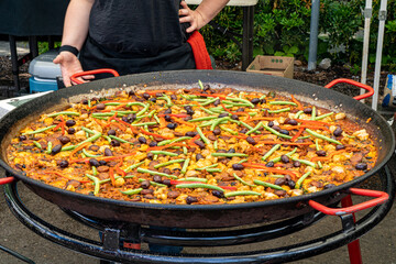 paella for sale at a farmers market in Salem Oregon.  Paella is a Spanish rice dish originally from...