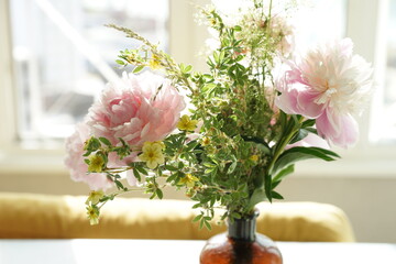 Bouquet of pink peonies in the interior
