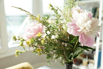 Bouquet of pink peonies in the interior