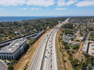 Fototapeta na wymiar Aerial view of highway transportation with small traffic, highway interchange and junction, San Diego Freeway interstate 5, California
