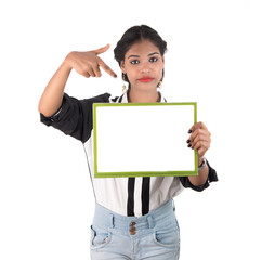 Girl holding blank white sign board on white background. Isolated portrait