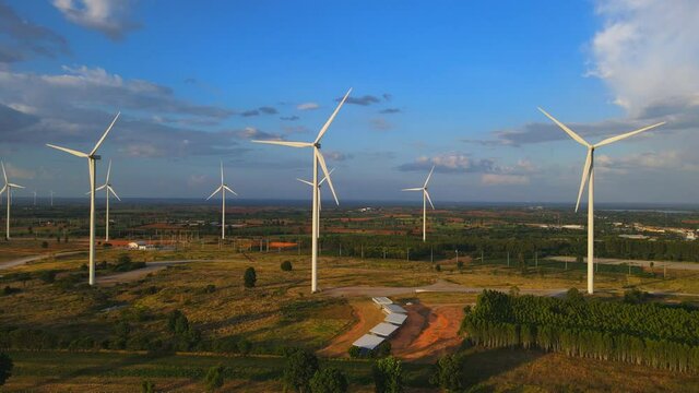 Panoramic view of wind farm or wind park, in the meadow field  are one of the cleanest, renewable electric energy source. with high wind turbines for generation electricity. Green energy concept.