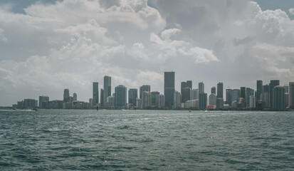 Fototapeta na wymiar city skyline from the sea Miami Florida usa sky clouds panoramic buildings downtown Brickell summer water 