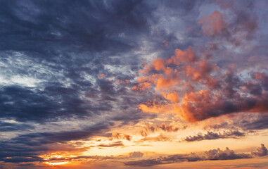 Fototapeta na wymiar dramatic vibrant and saturated sky with beautiful clouds of sunrise and sunset