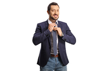 Casual young man fixing his tie